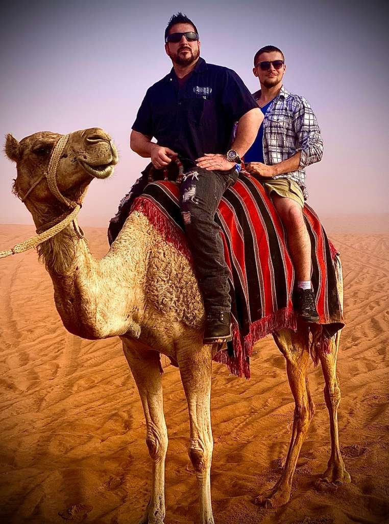 Barry Billcliff family travel photo on a camel in the Dubai desert