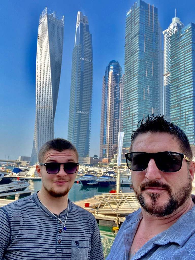 Barry Billcliff family travel selfie at the Dubai marina skyline