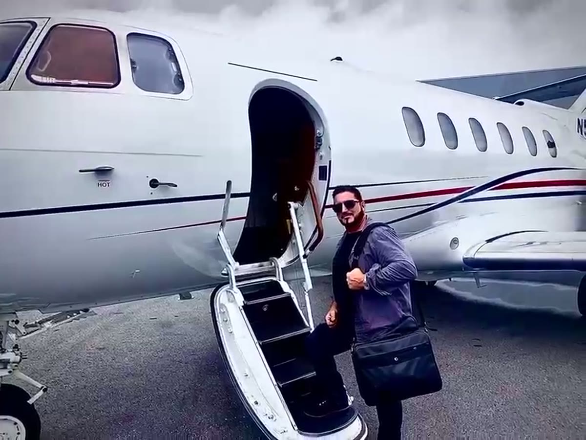 Barry Billcliff boarding a private jet in an aviation archive video still
