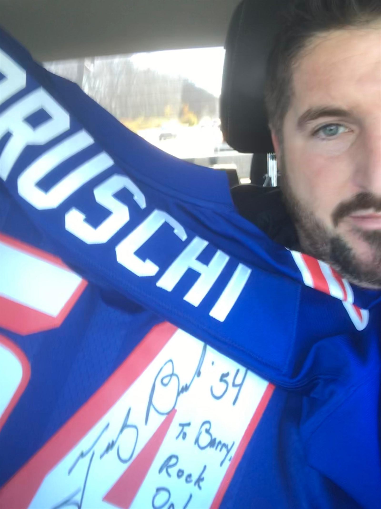 Barry Billcliff with a signed sports jersey from his archive